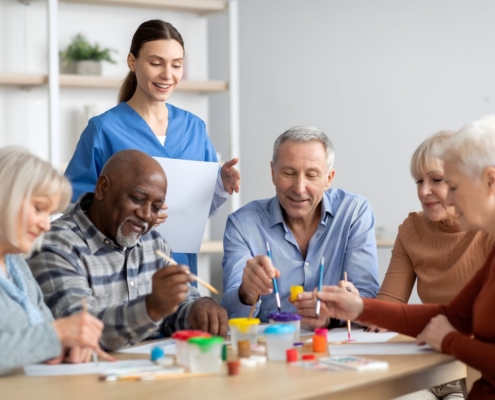 happy-elderly-men-and-women-doing-arts-and-crafts